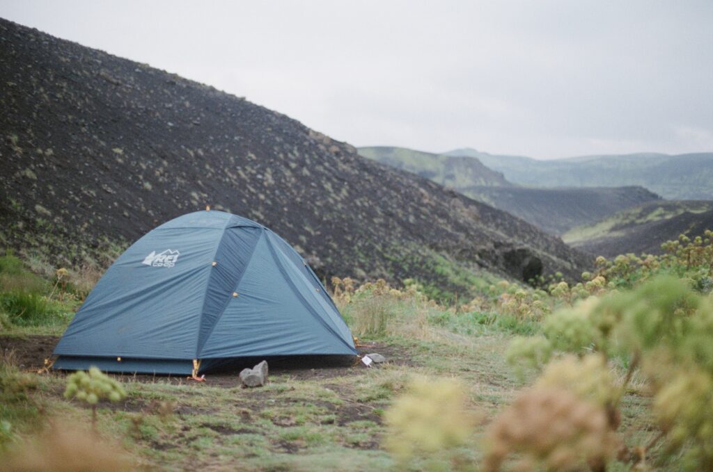 campsite in iceland with blue tent 