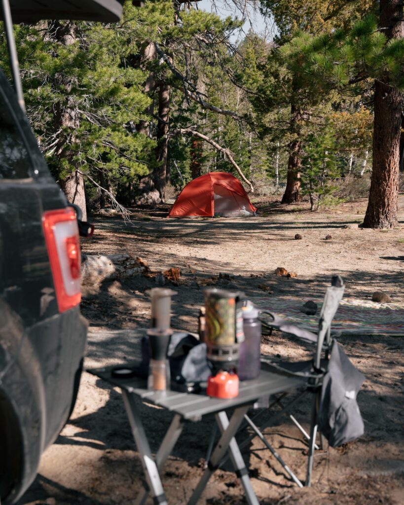 campsite with tent and cooking items
